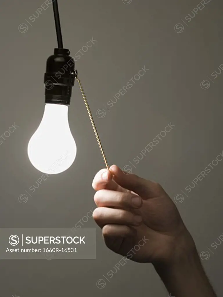 Man pulling light switch