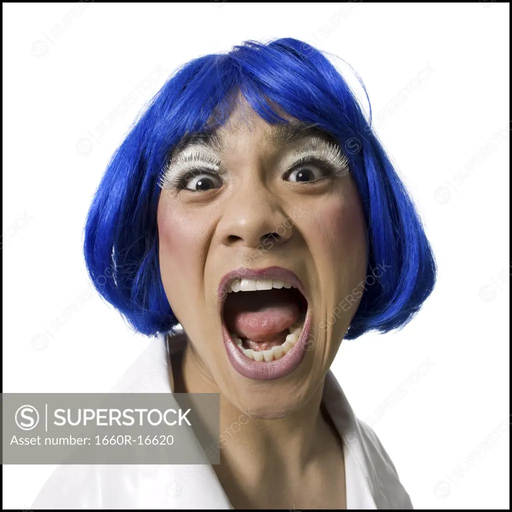 Man with blue wig and makeup yelling