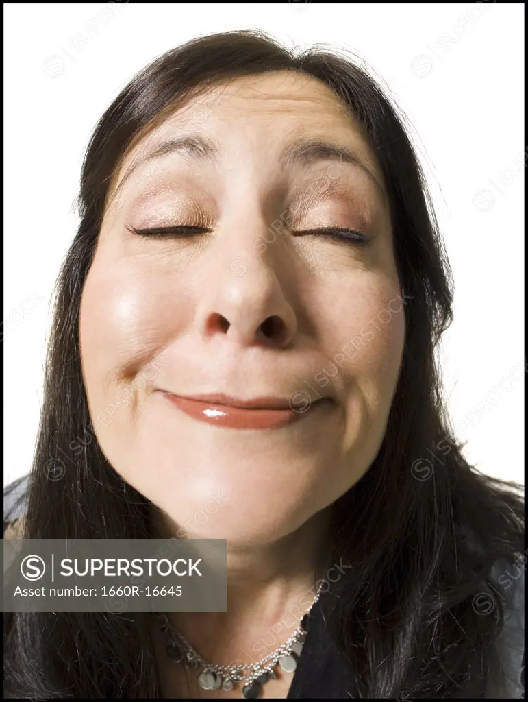 Closeup of woman with funny face eyes closed