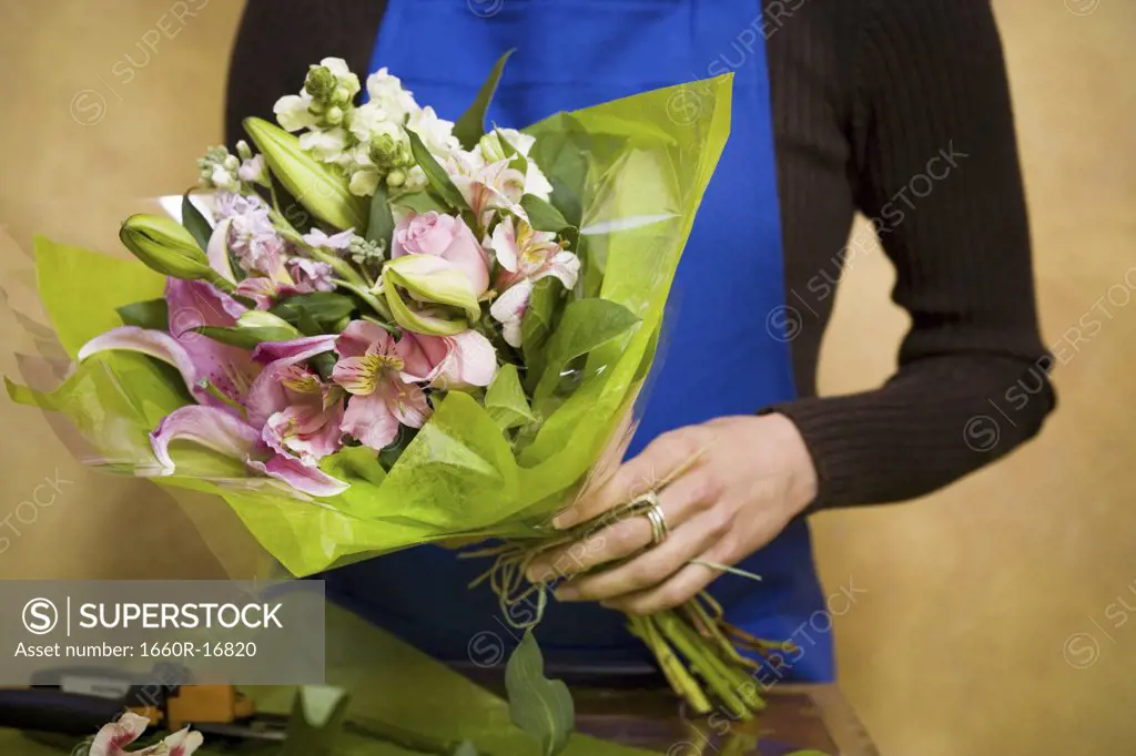 Florist preparing floral arrangement