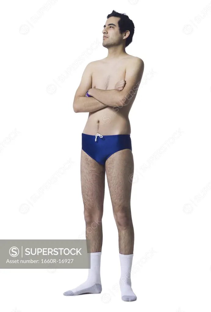 Man in swimsuit and socks with arms crossed
