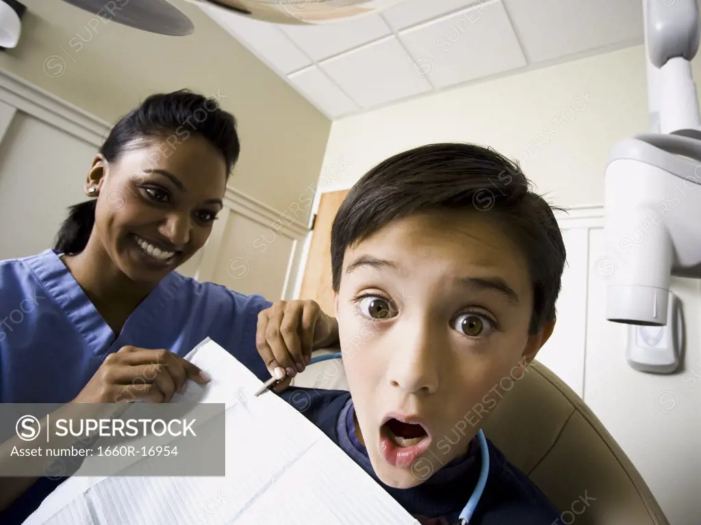 Boy at dentist with hygienist