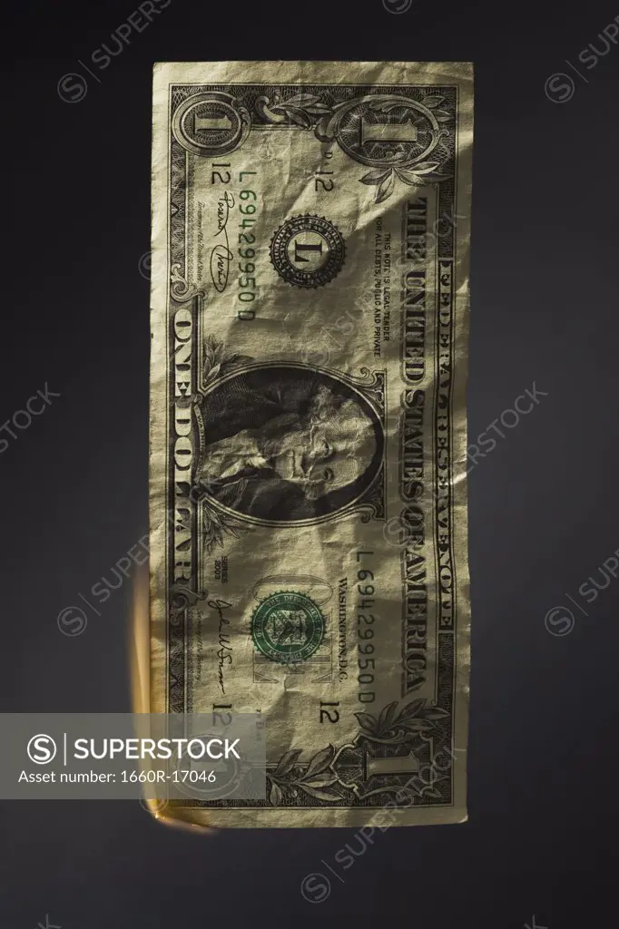 United States one dollar bill on fire