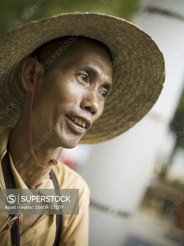 Portrait of a man in sunhat