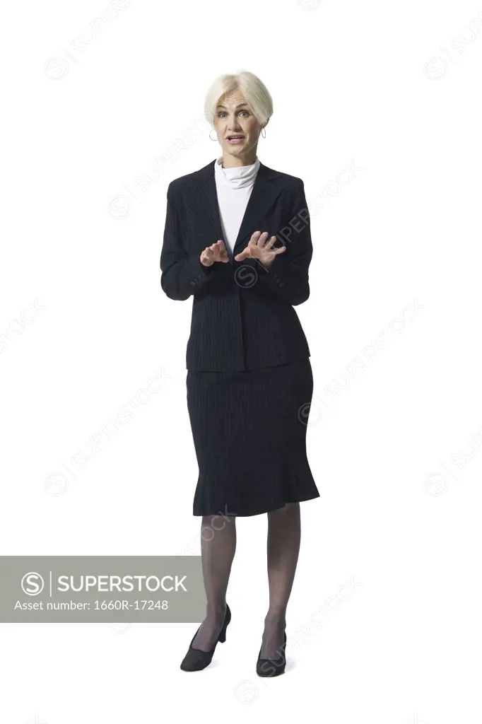 Mature businesswoman standing and gesturing with hands