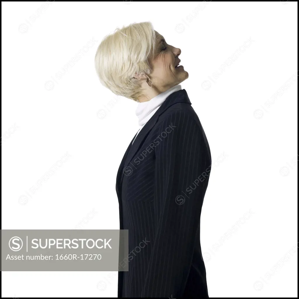 Profile of a mature businesswoman with head on backwards