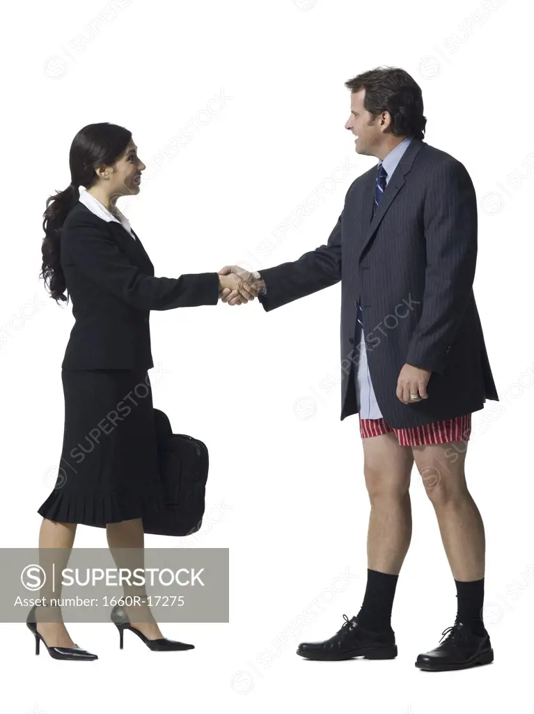 Businesswoman shaking hands with businessman in boxers