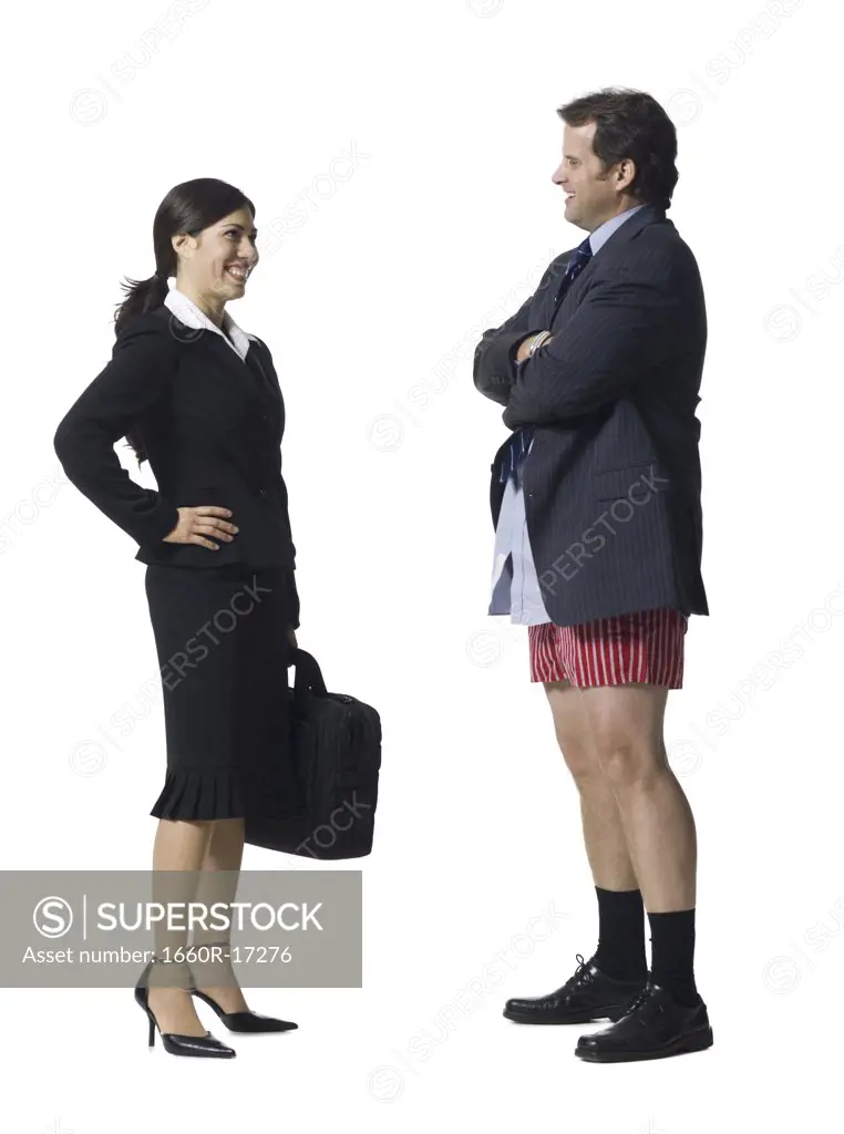 Businesswoman talking and smiling with businessman in boxers