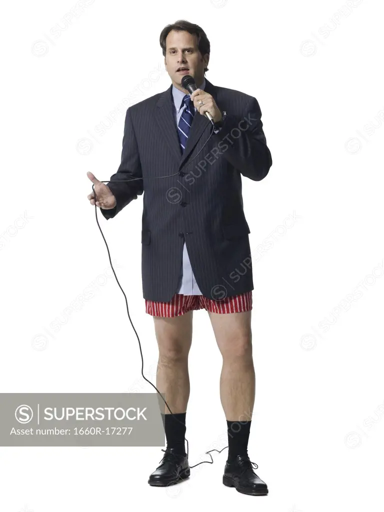 Businessman in boxers with microphone