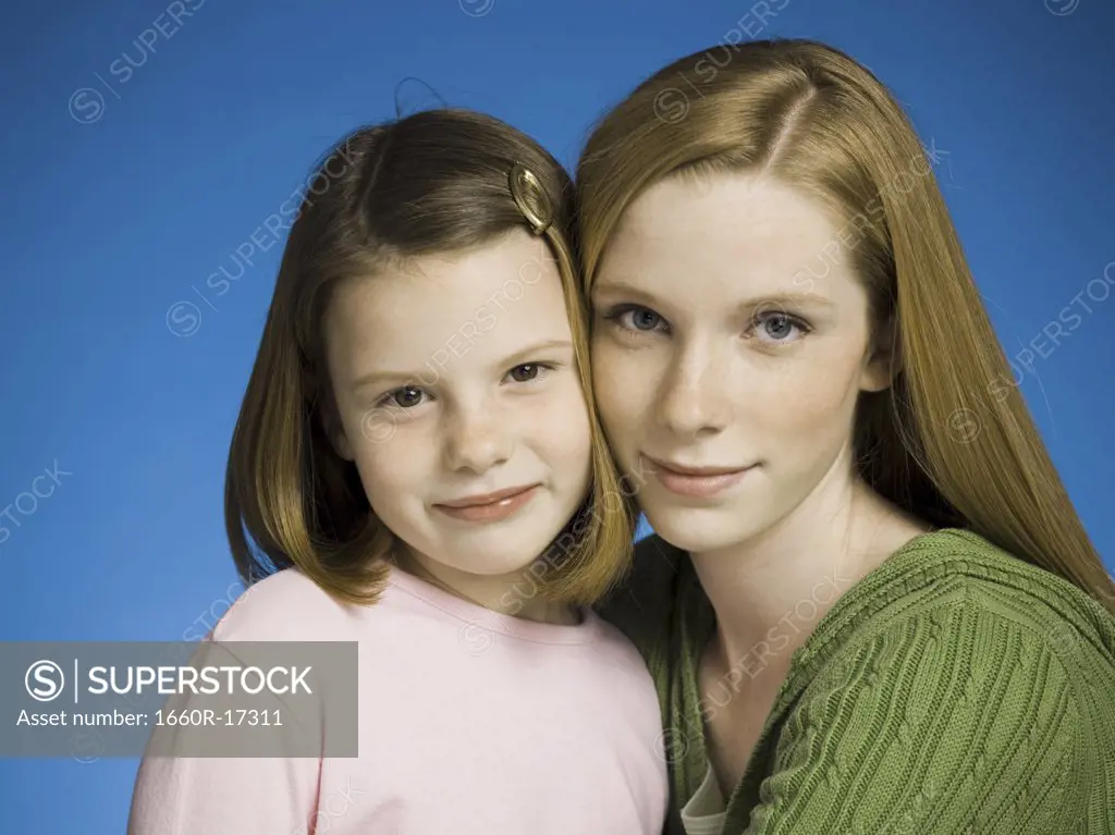 Portrait of teenage girl and young girl