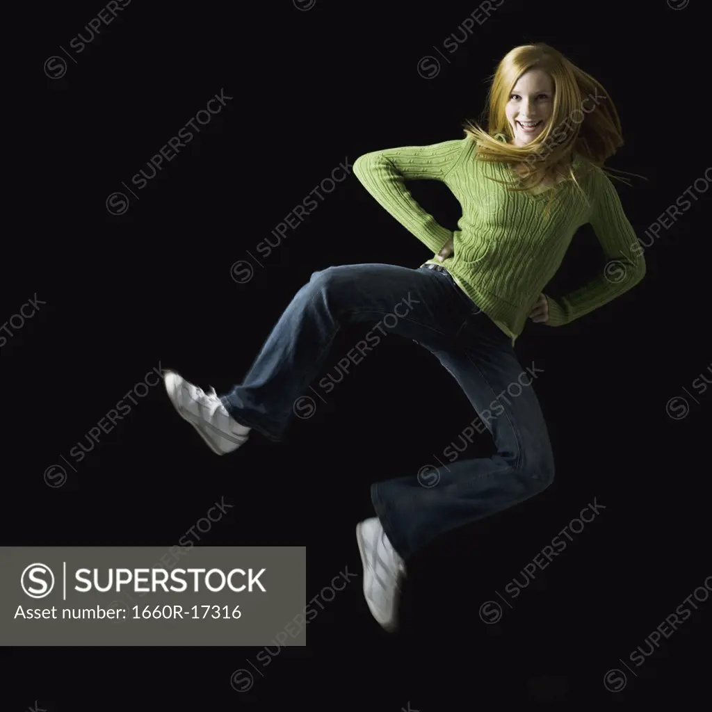 Girl leaping and smiling