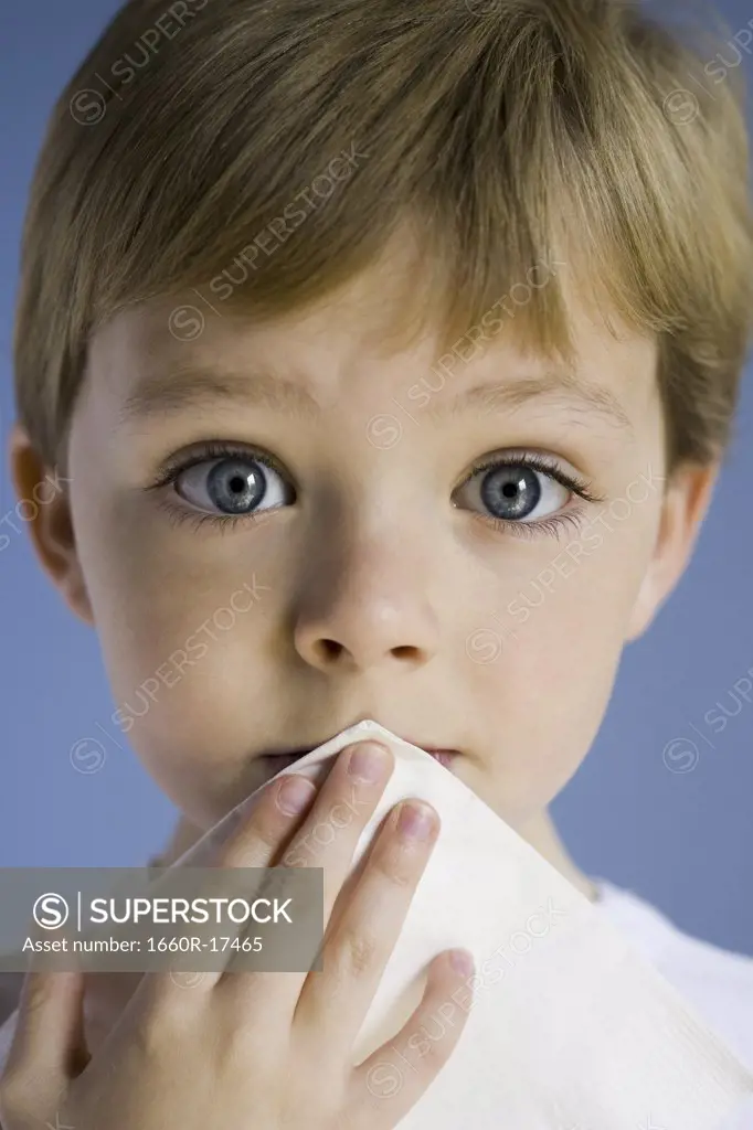 Closeup of boy holding napkin