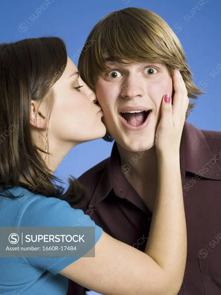 Girl kissing boy on cheek