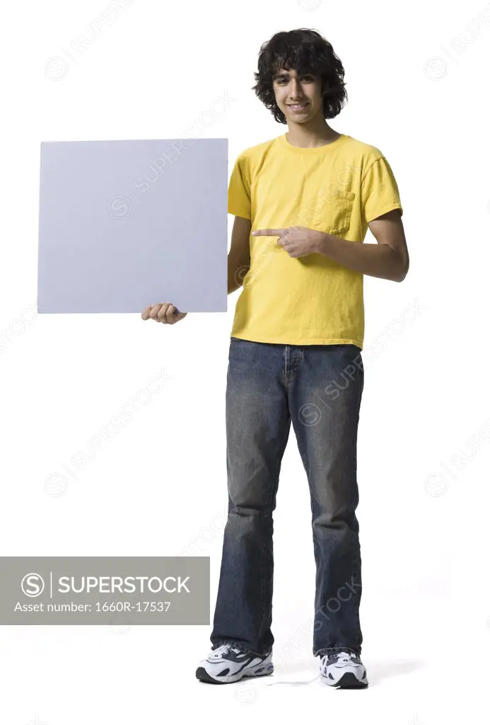 Teenage boy holding blank sign