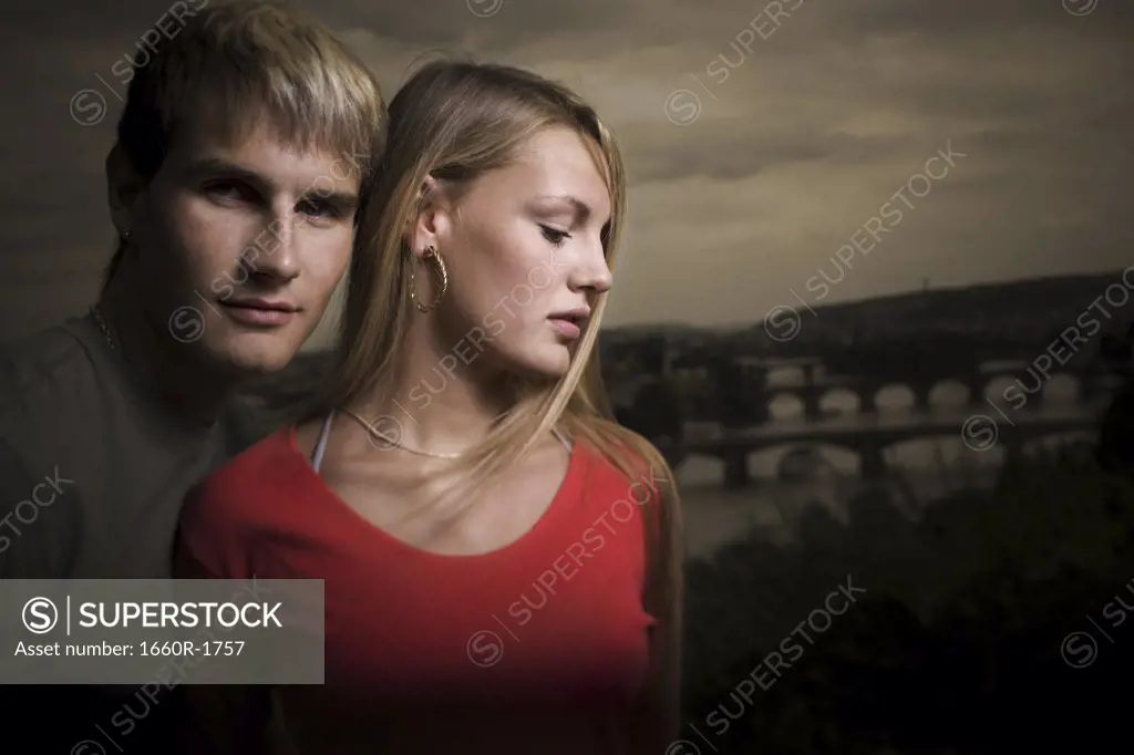 Portrait of a young man with a teenage girl