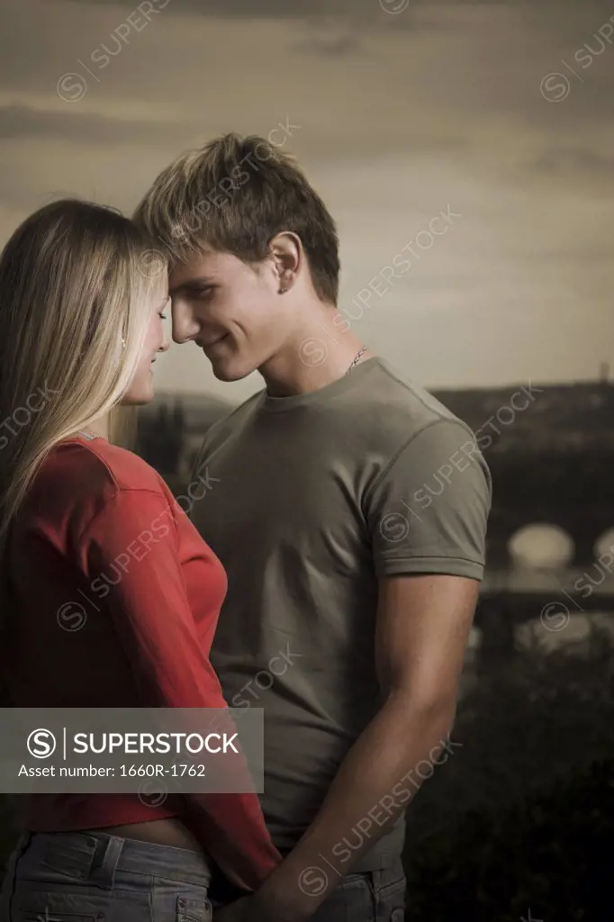 Profile of a young man looking at a young woman