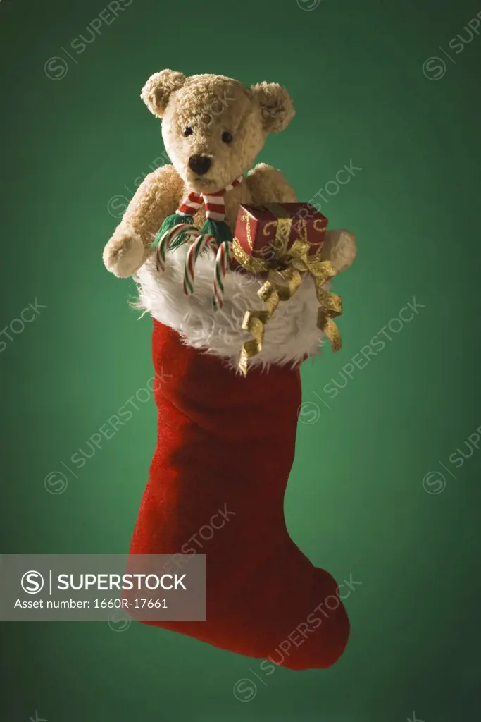 Christmas stocking with teddy bear and candy canes