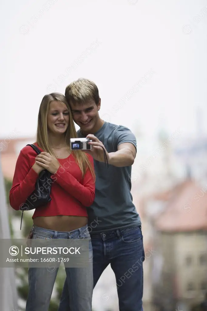 Young man and a young woman taking a photograph of themselves