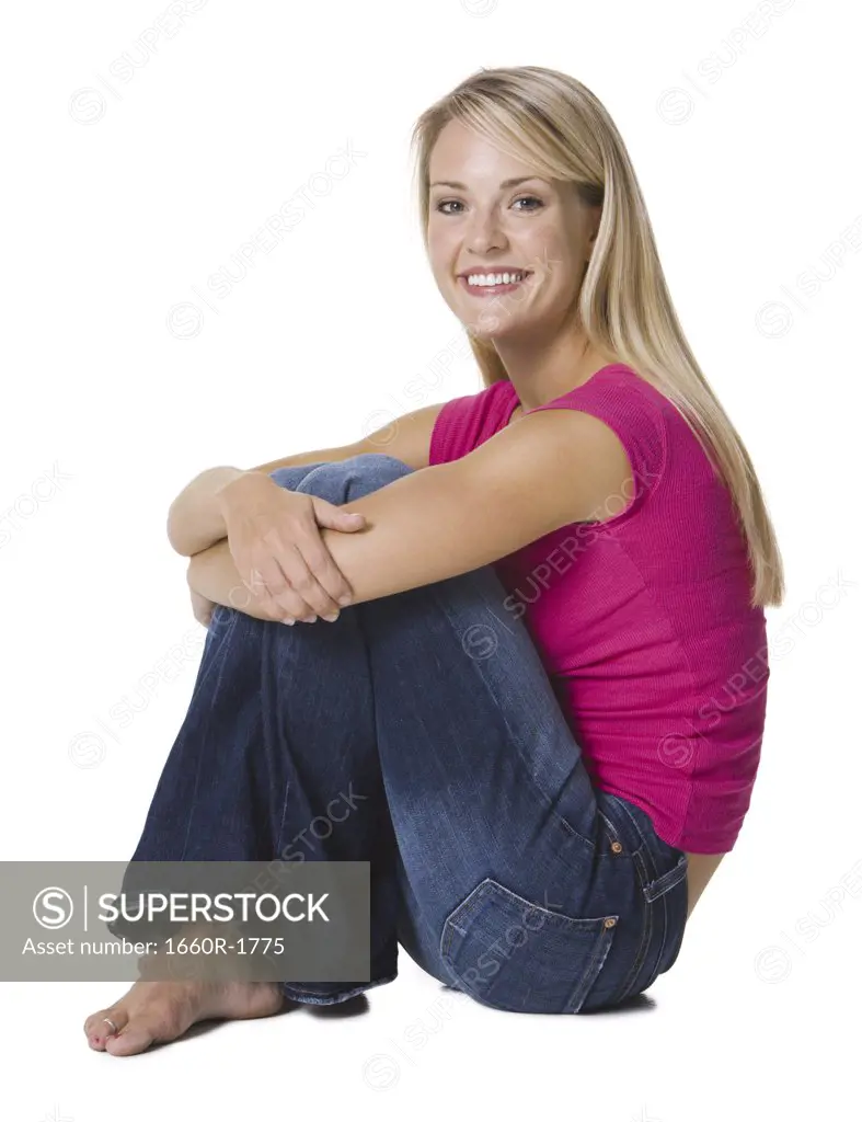 Young woman sitting and smiling
