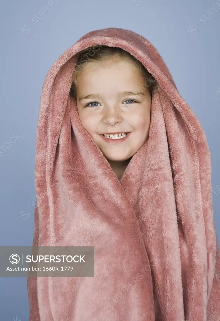 Portrait of a girl wrapped in a blanket