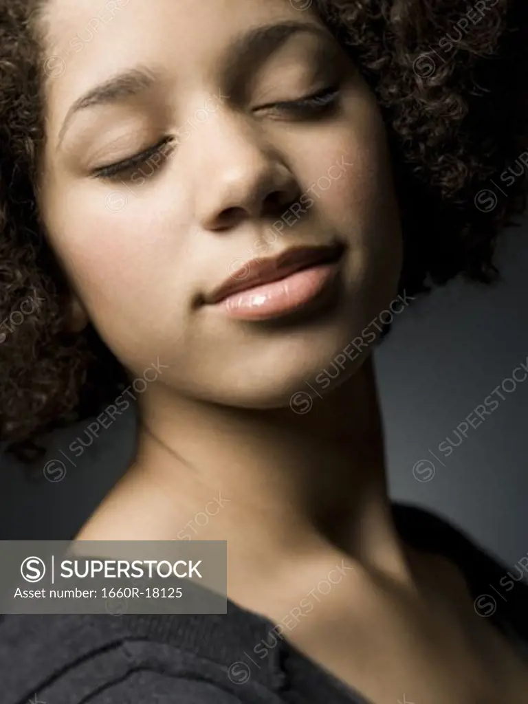 Closeup of teenage girl with eyes closed