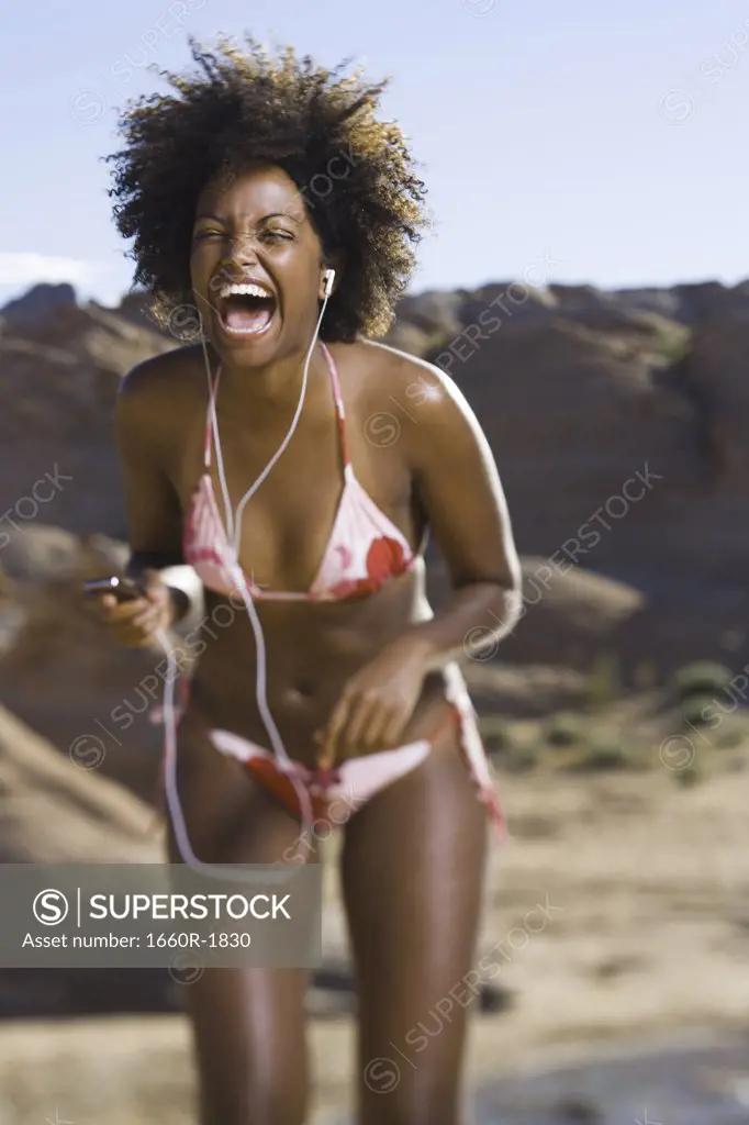 Young African-American woman listening to music