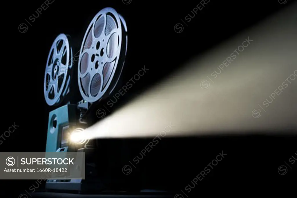 Movie projector with beam of light