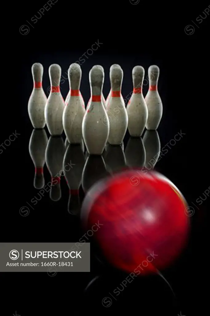 Bowling pins and bowling ball in motion