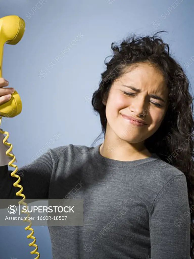 Woman holding phone away