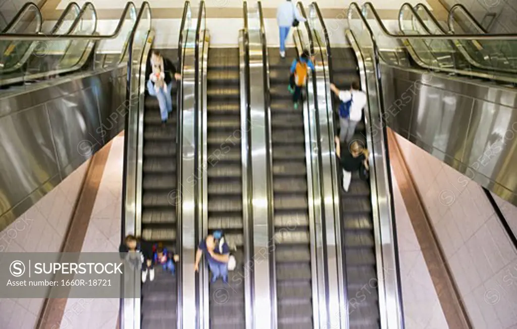 Escalators with people and motion blur