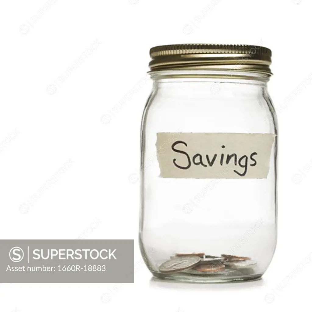 Glass jar with change and Savings label