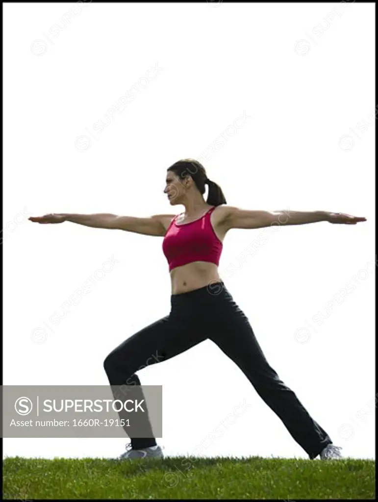 Profile of woman stretching outdoors