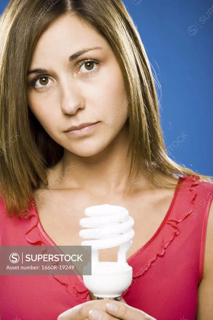 Woman holding energy efficient lightbulb