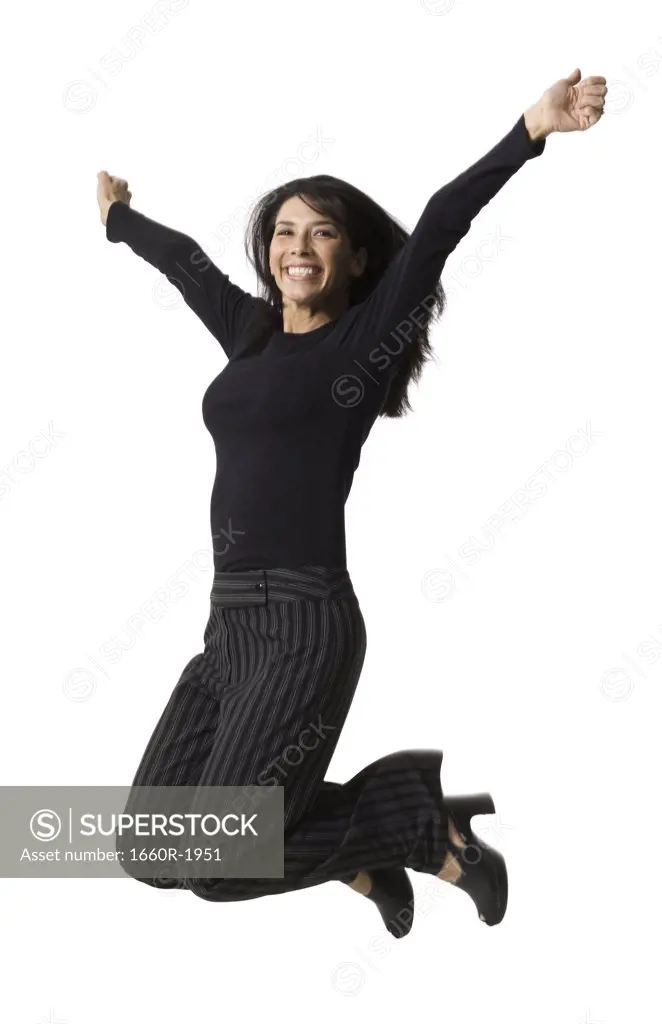 Portrait of a mid adult woman jumping
