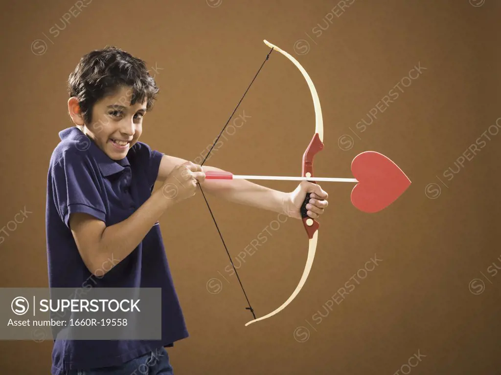 Boy with bow and arrow with heart on it