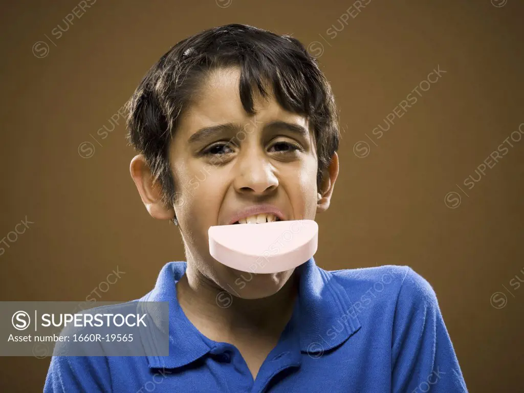 Boy with bar of soap in mouth