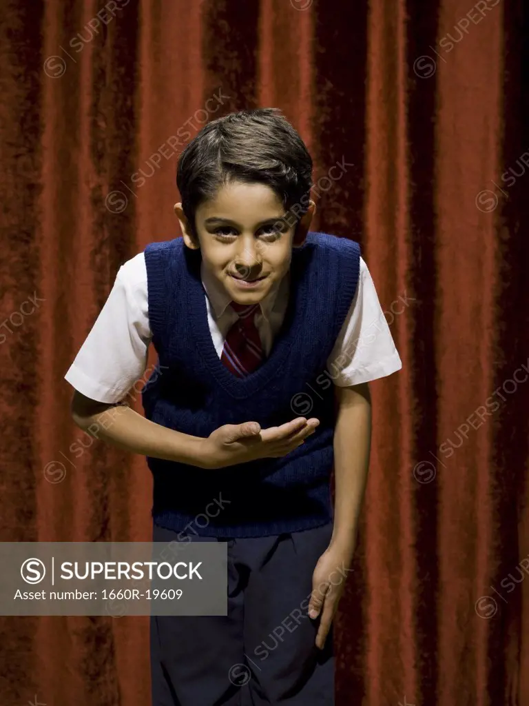 Boy taking a bow on stage
