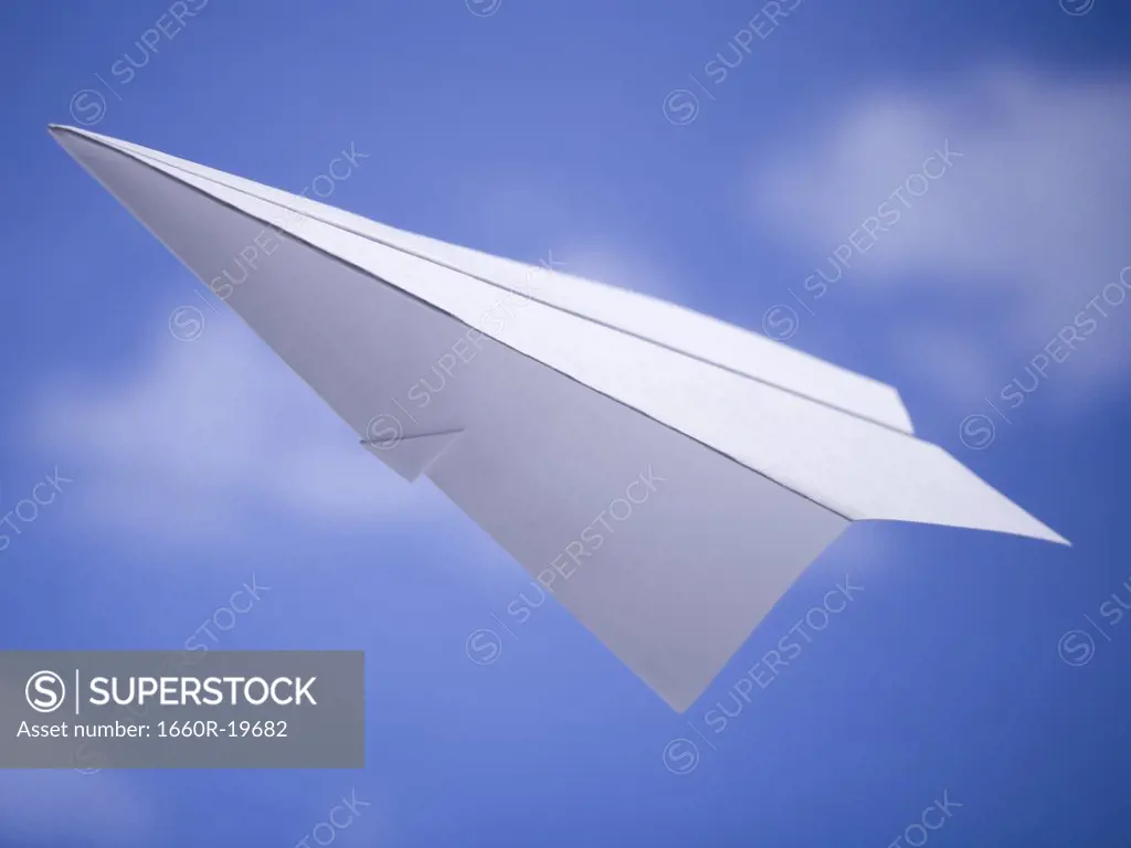 Paper airplane with blue sky