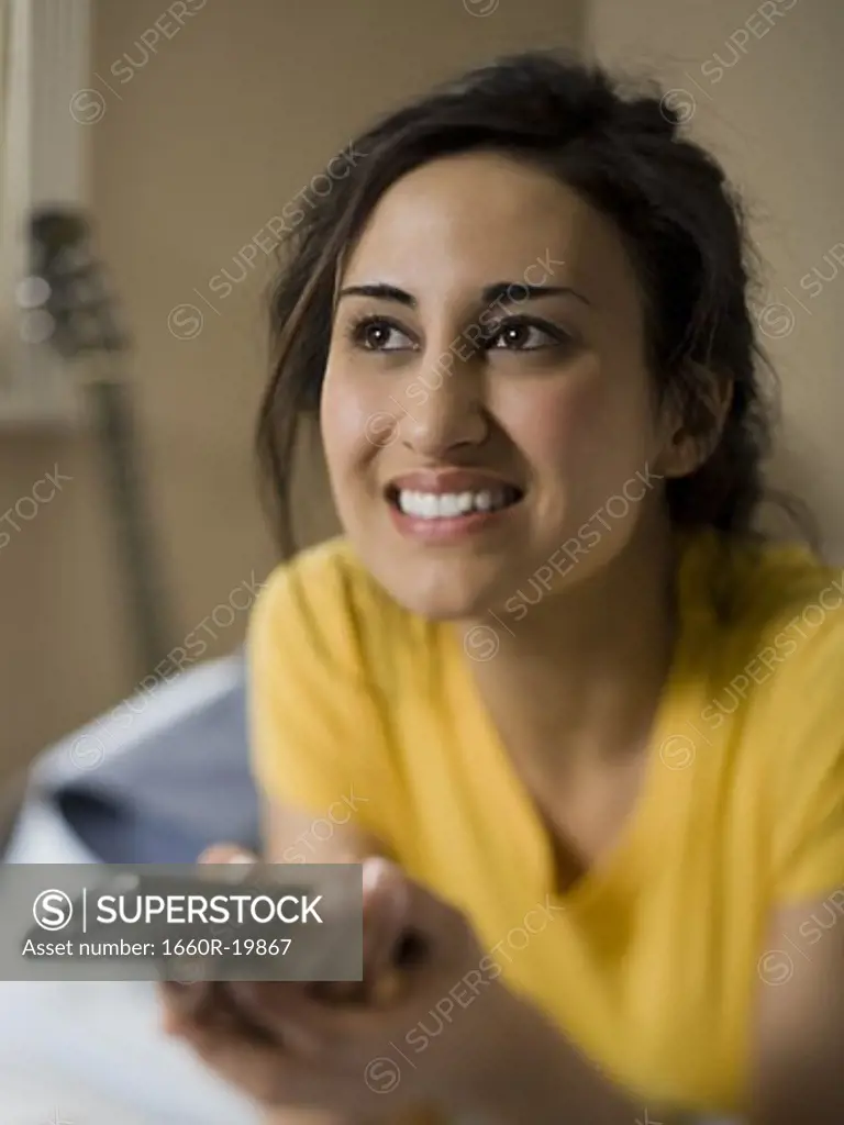 Woman with remote control smiling