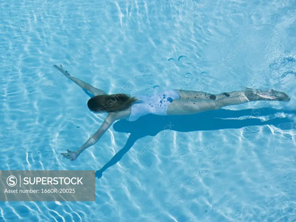 Woman swimming in pool