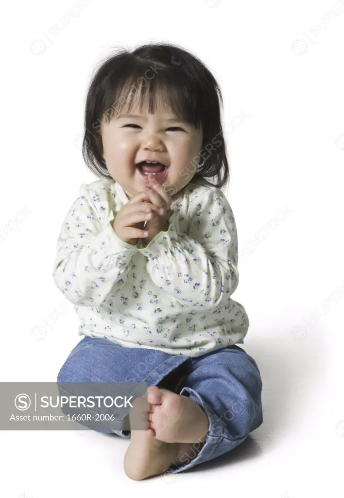 Close-up of a baby girl laughing