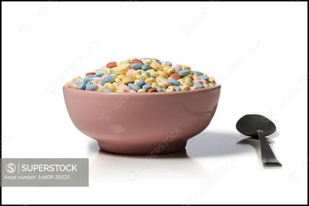 Bowl filled with medication with spoon