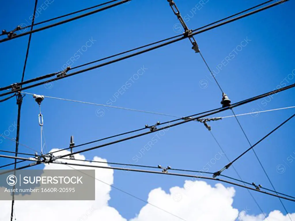 Power lines with blue sky and clouds