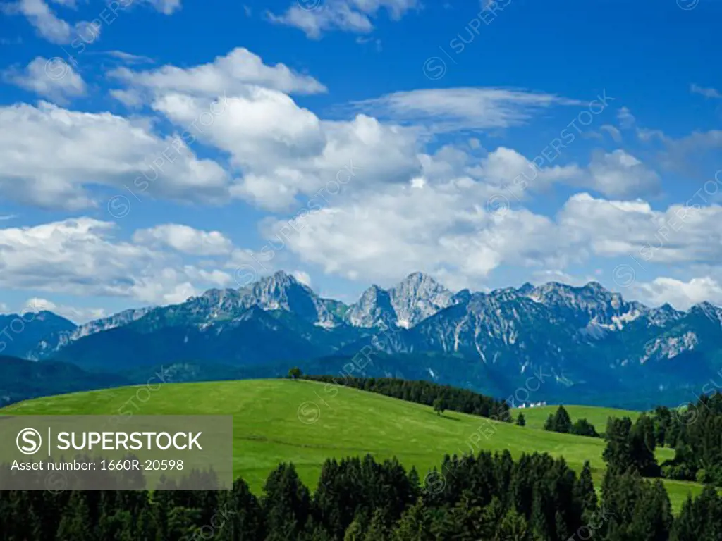 Valley and mountains with blue sky and clouds