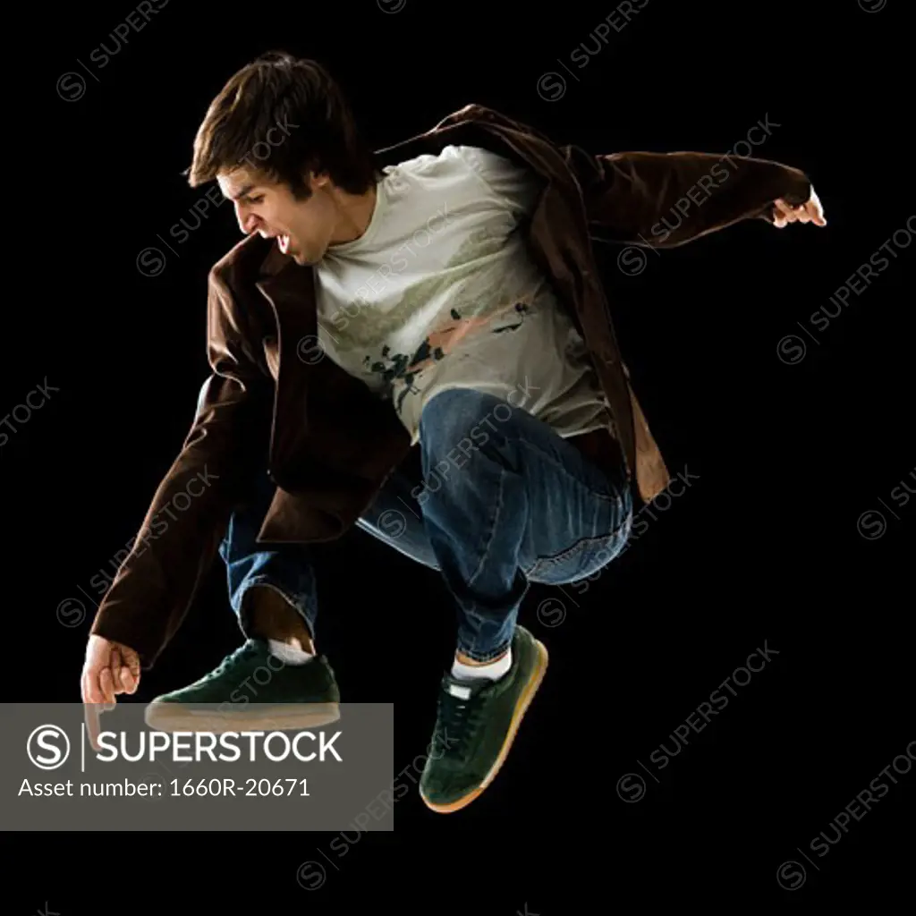 young man jumping in the air.
