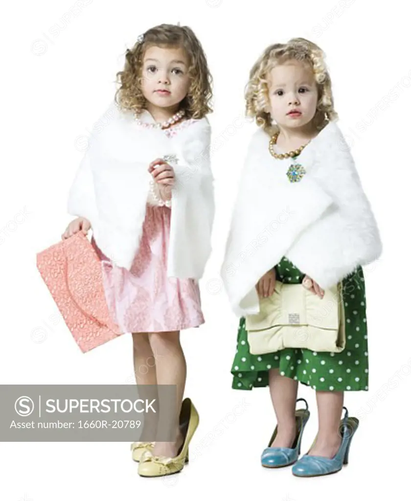 two girls playing dress up
