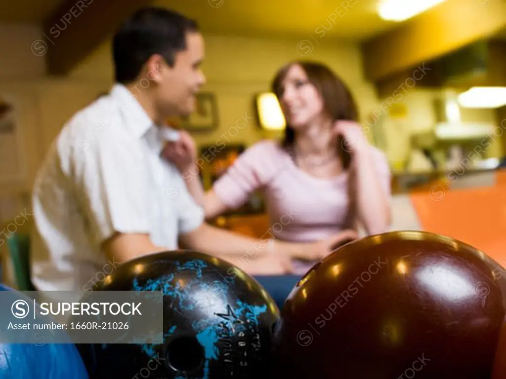 Man and woman bowling