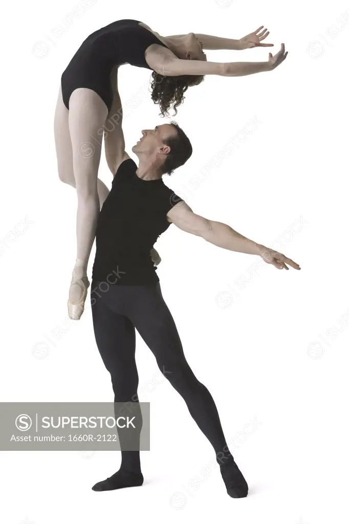 Male ballet dancer lifting a female ballerina