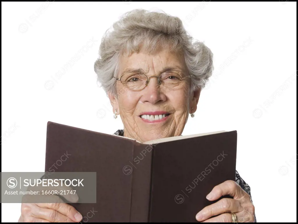 Senior woman reading a book.