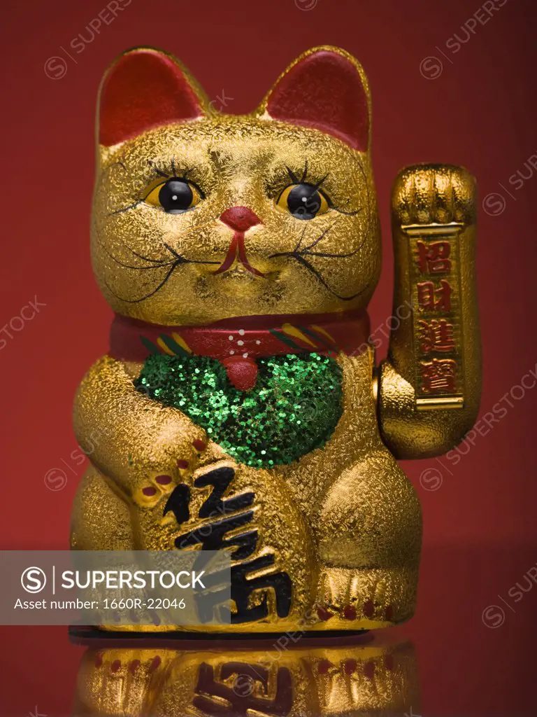 Golden asian cat toy.